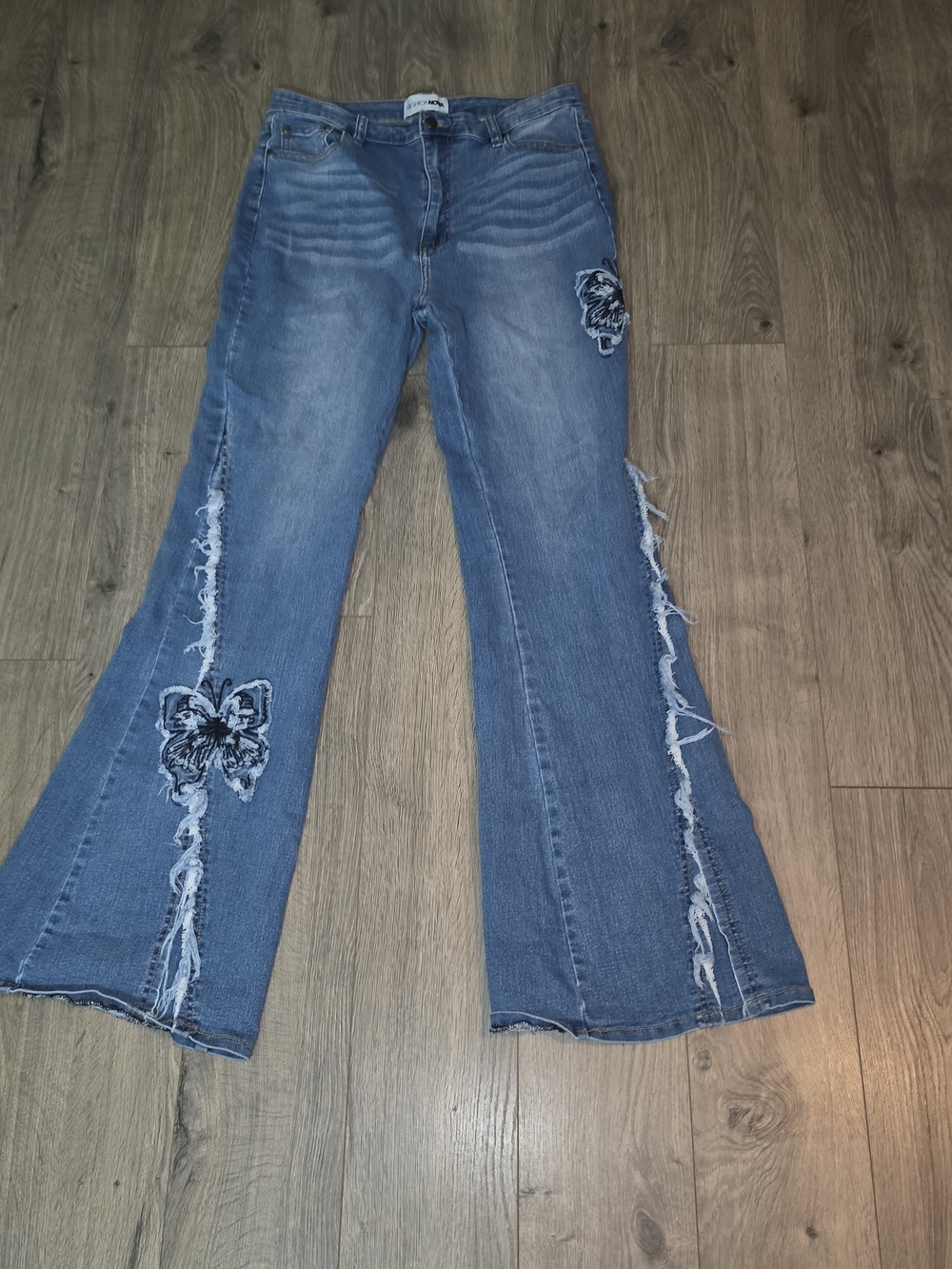 Fashion Nova Blue Frayed Flare Jeans with Butterfly Patches